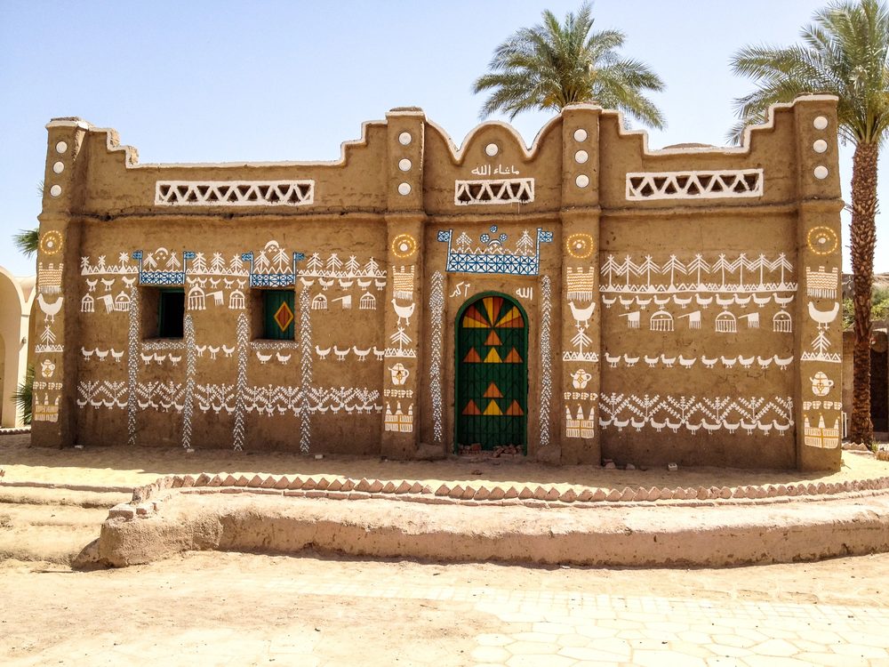 A brightly painted Nubian house on the Nile at Aswan